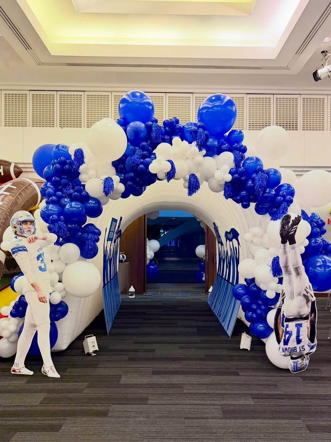 Detroit Lions football themed balloon arch with player cutouts